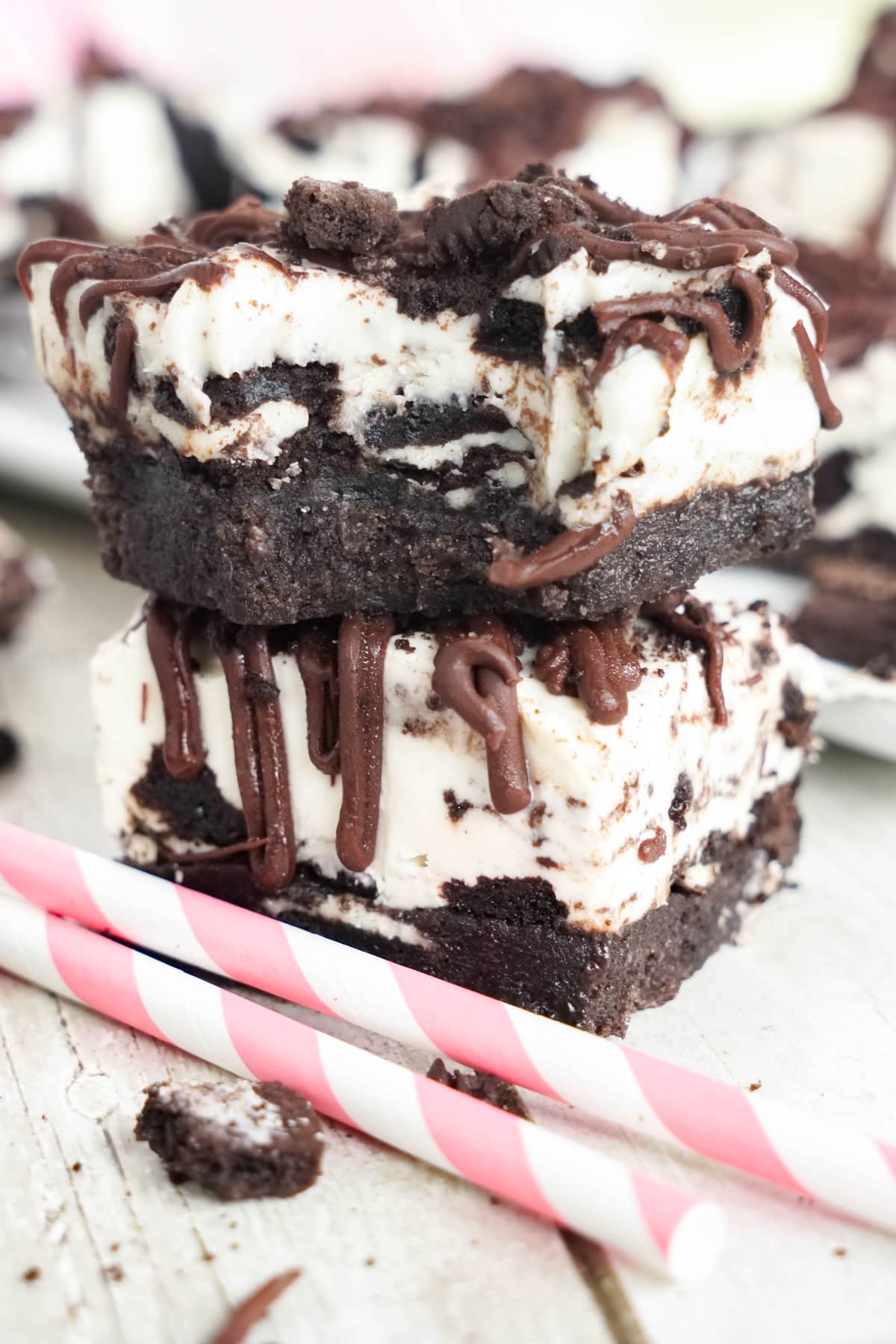 stack of oreo cheesecake bars with bite out