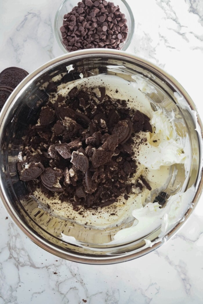 oreo pieces in cheesecake mixture