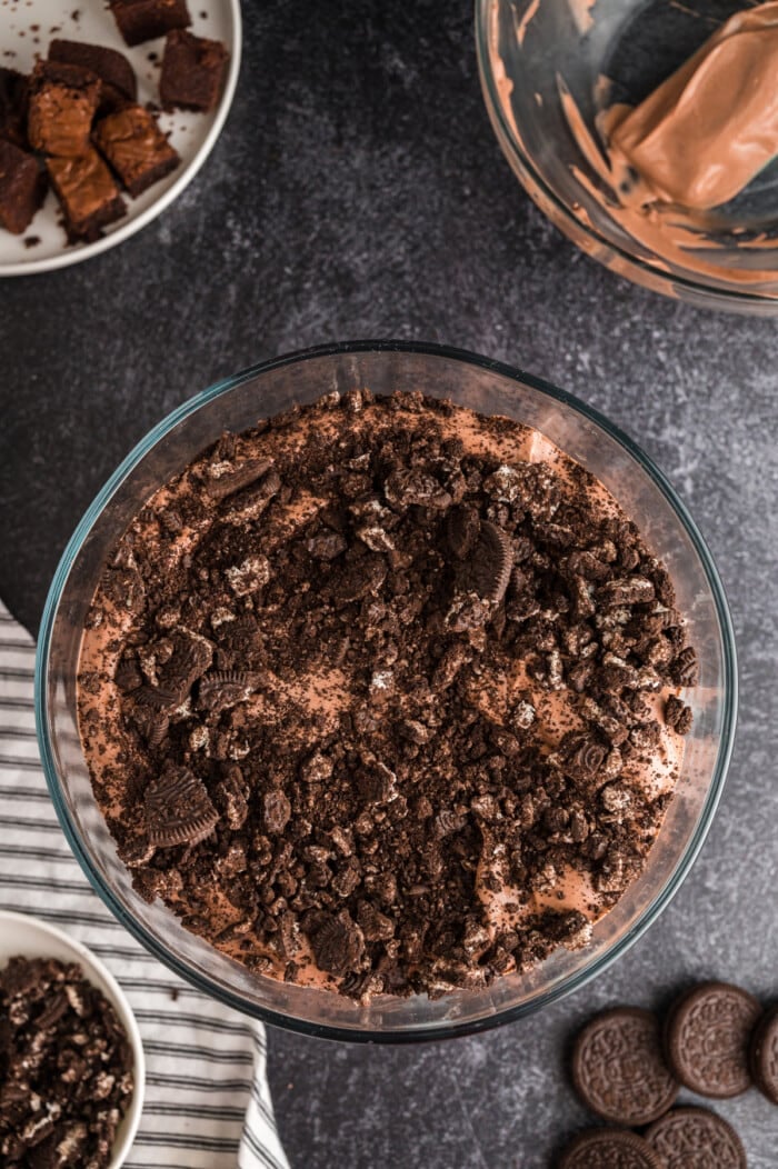 crushed oreos on top of chocolate pudding for Oreo trifle