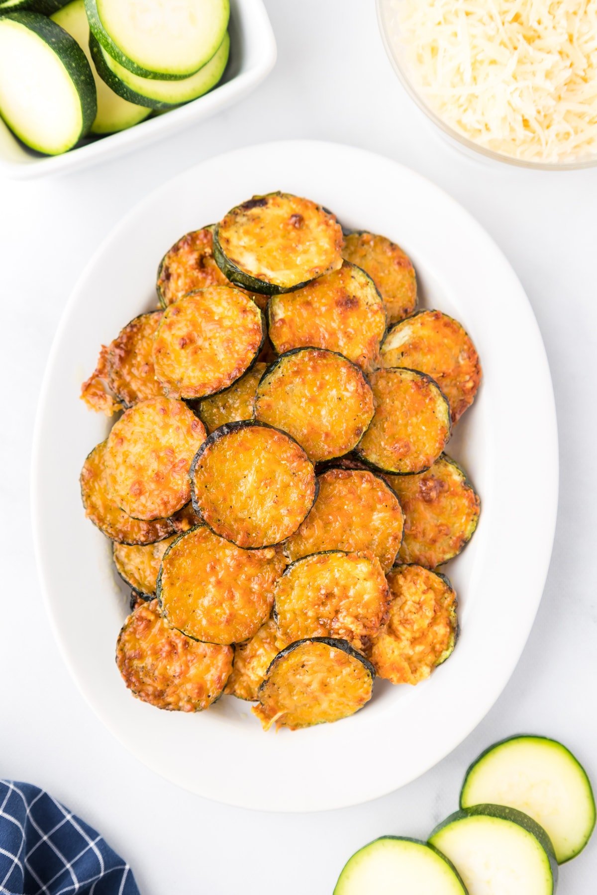 parmesan zucchini on white platter