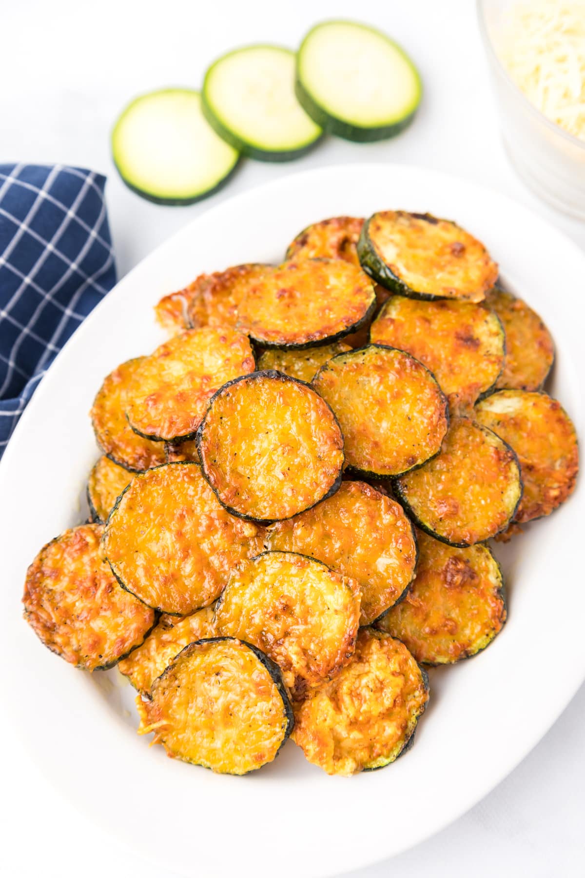 parmesan zucchini on white platter