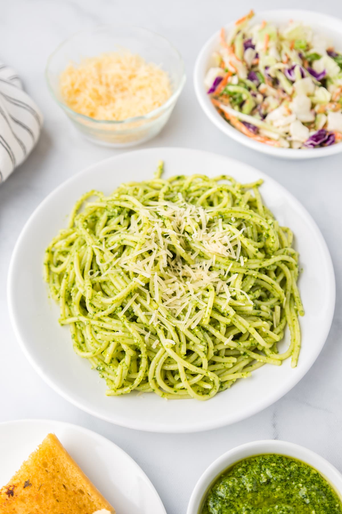 A plate of pesto pasta with parmesan
