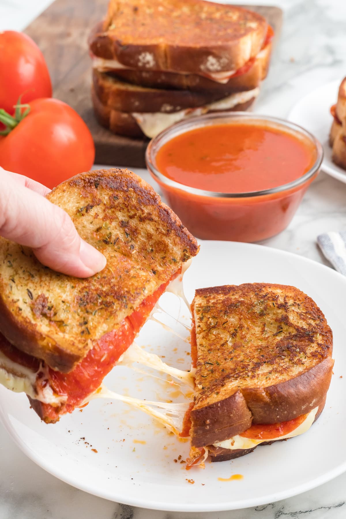 hand holding pizza grilled cheese