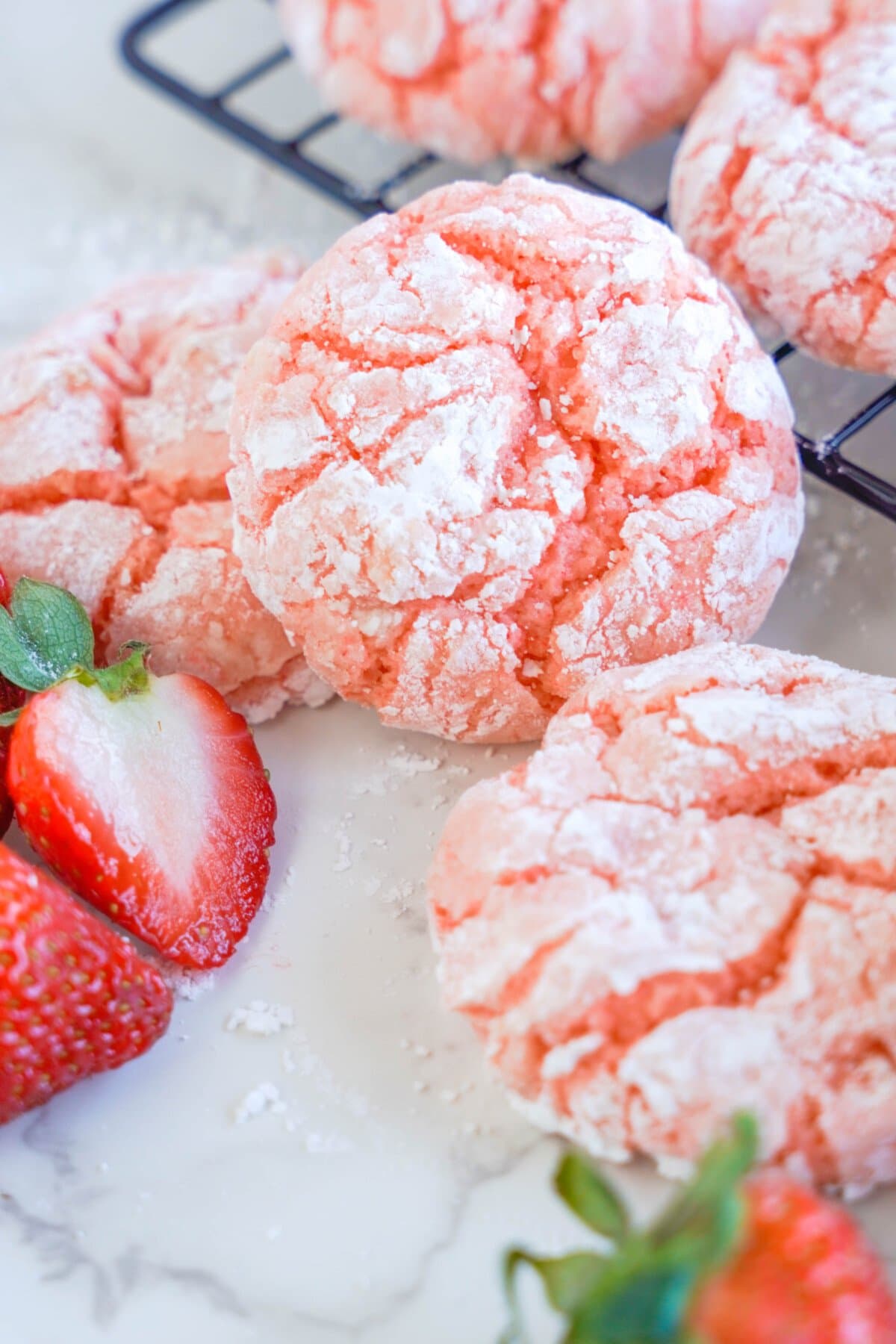 Strawberry Crinkle Cookies on a wire rack