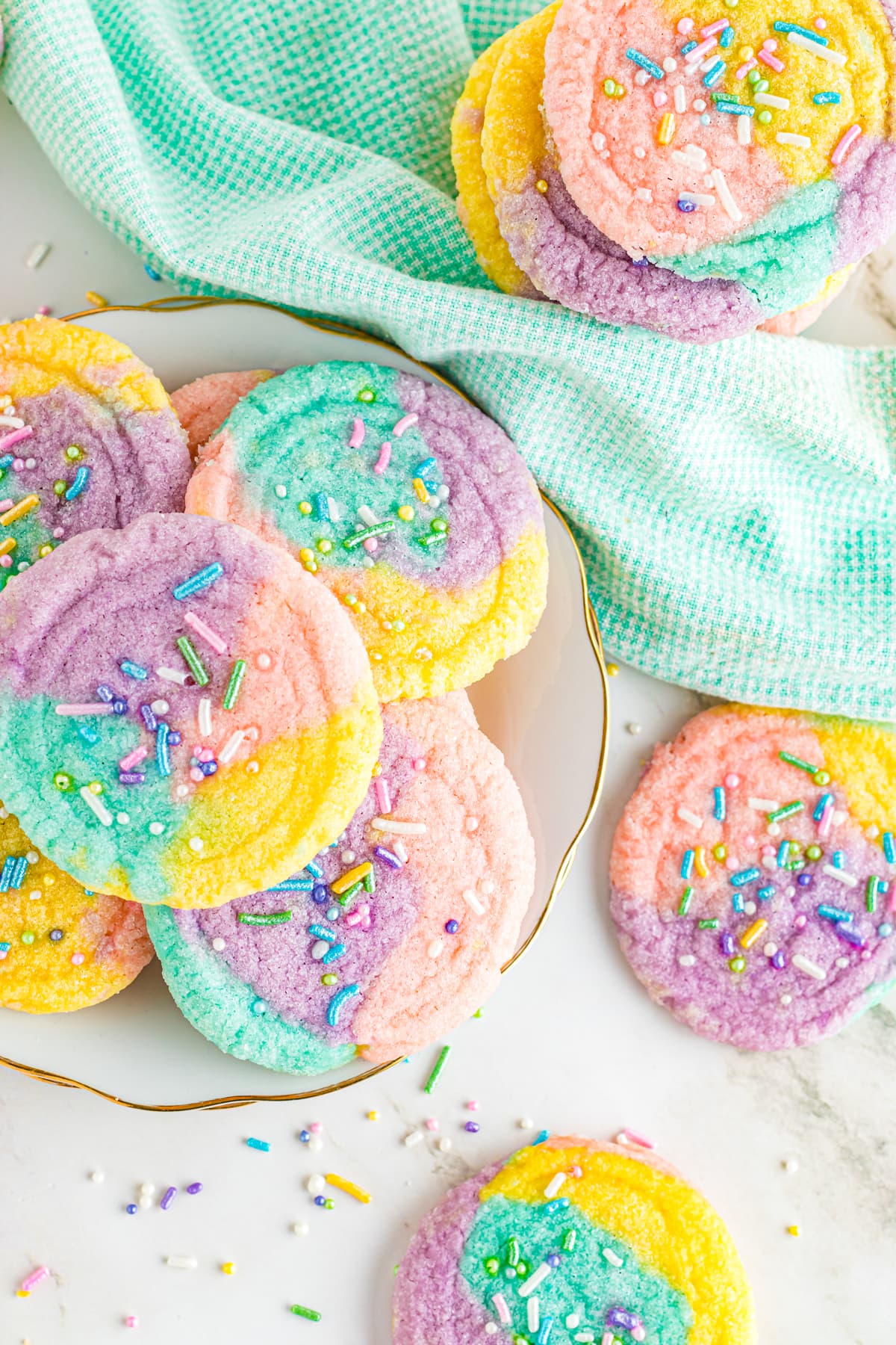 unicorn cookies with sprinkles on plate
