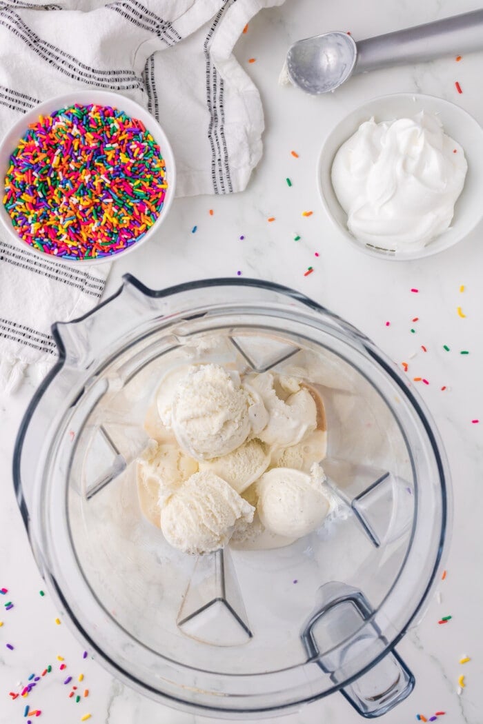 ice cream in blender with milk and vanilla extract