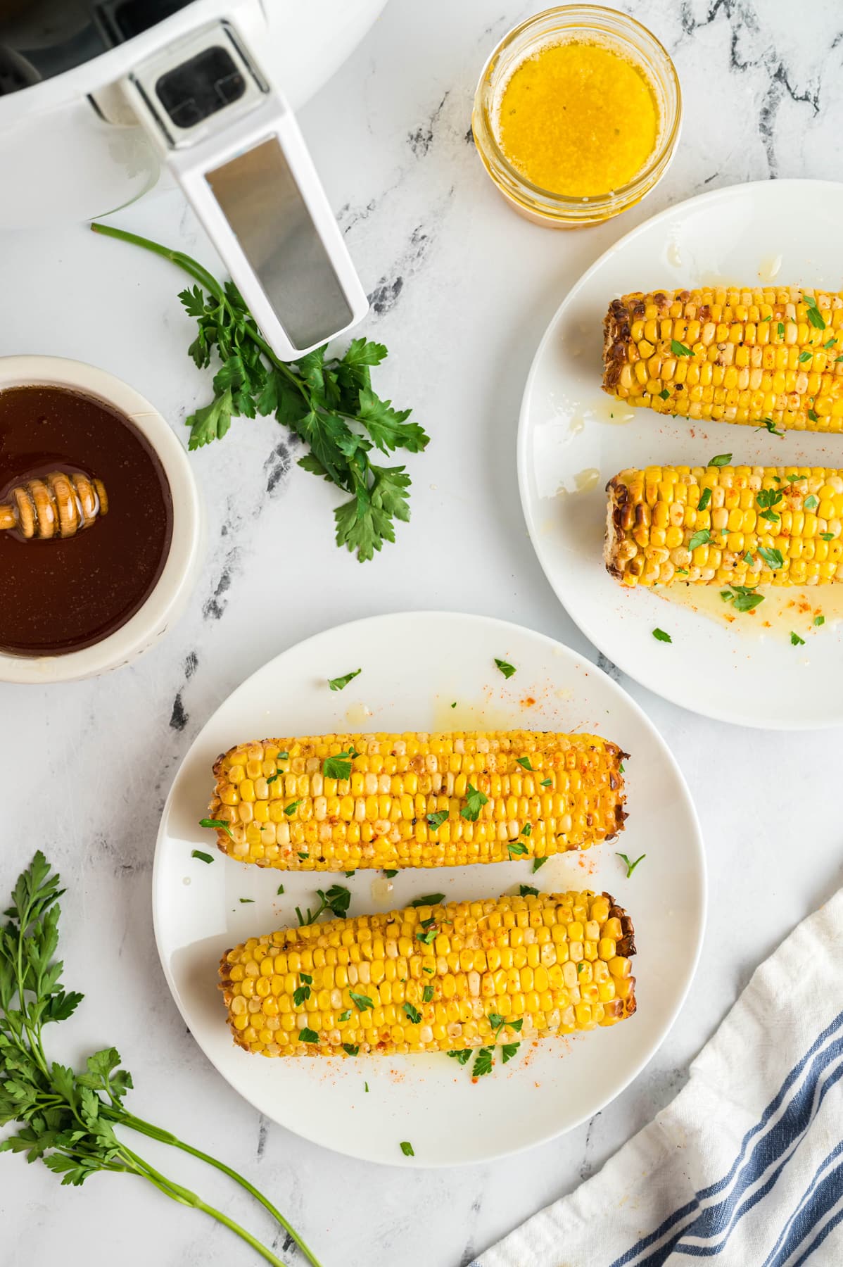 air fryer corn on the cob with butter and parsley