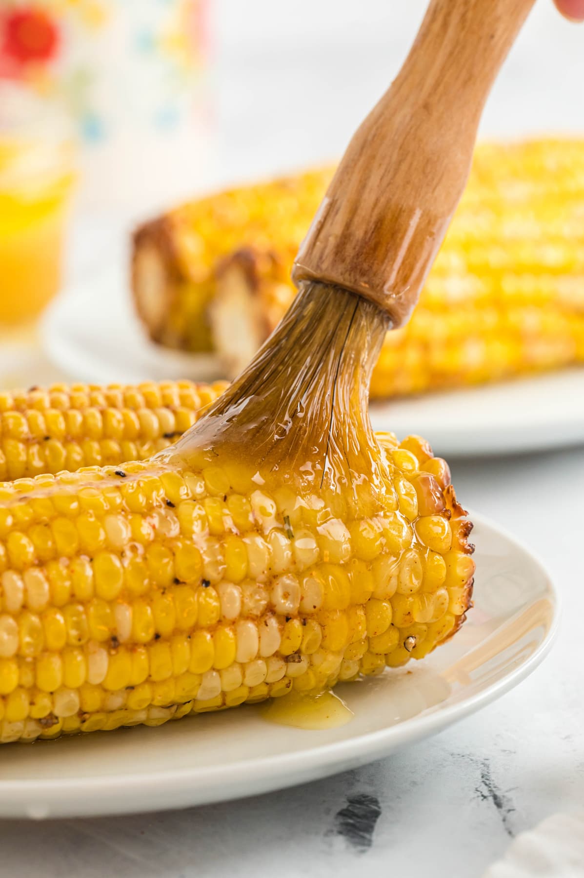 melted butter brushed on air fryer corn on the cob