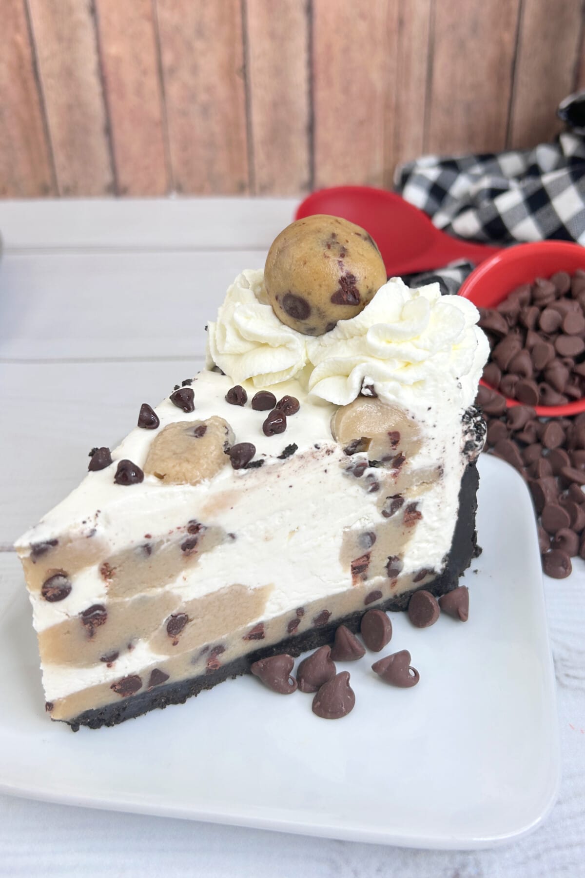 Chocolate Chip Cookie Dough Cheesecake on a white plate