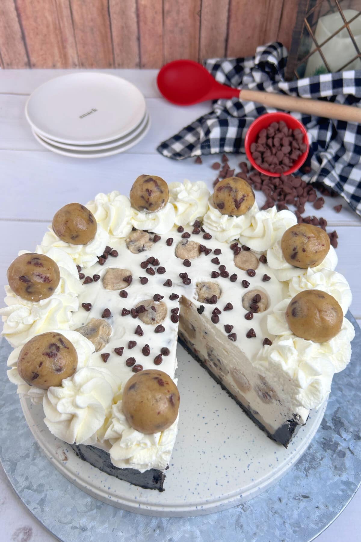 Chocolate Chip Cookie Dough Cheesecake with a piece cut out