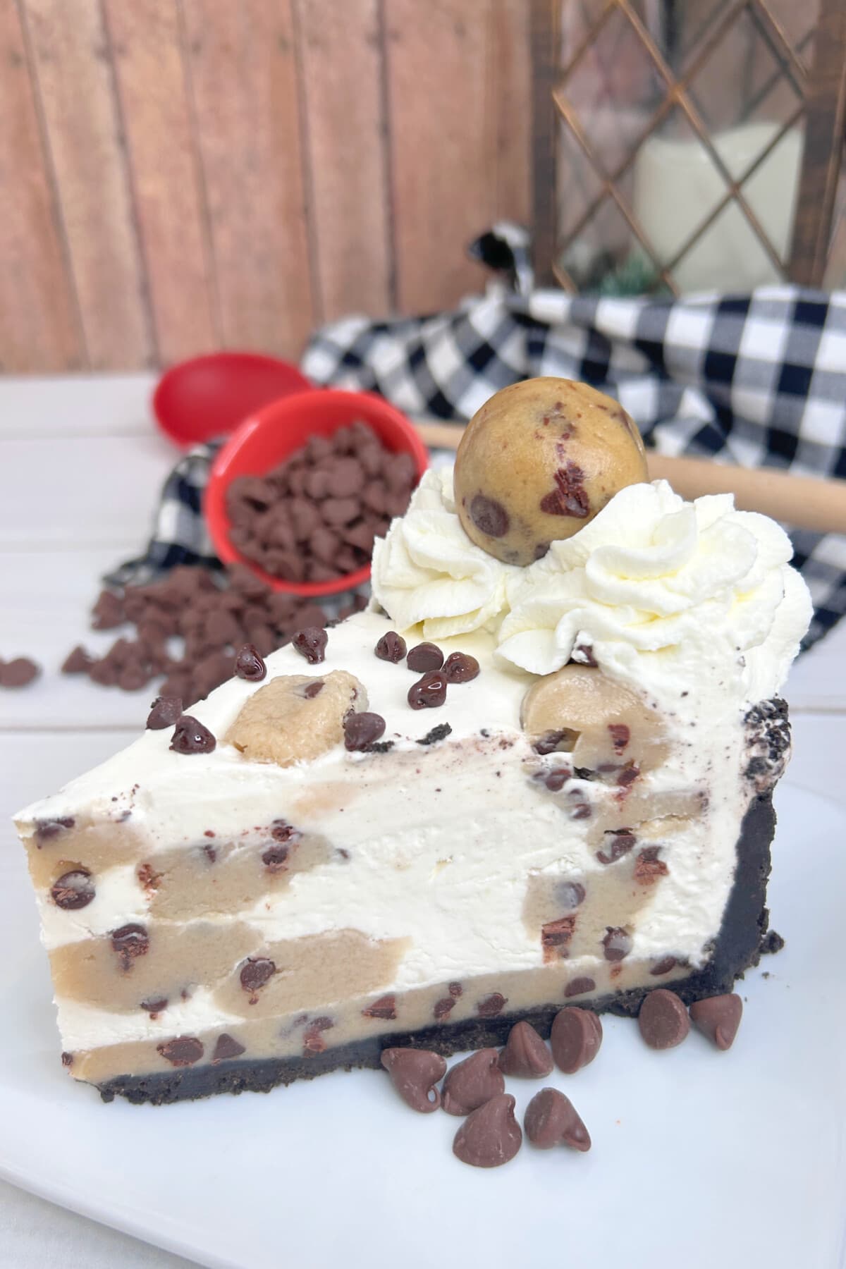 Chocolate Chip Cookie Dough Cheesecake on a white plate