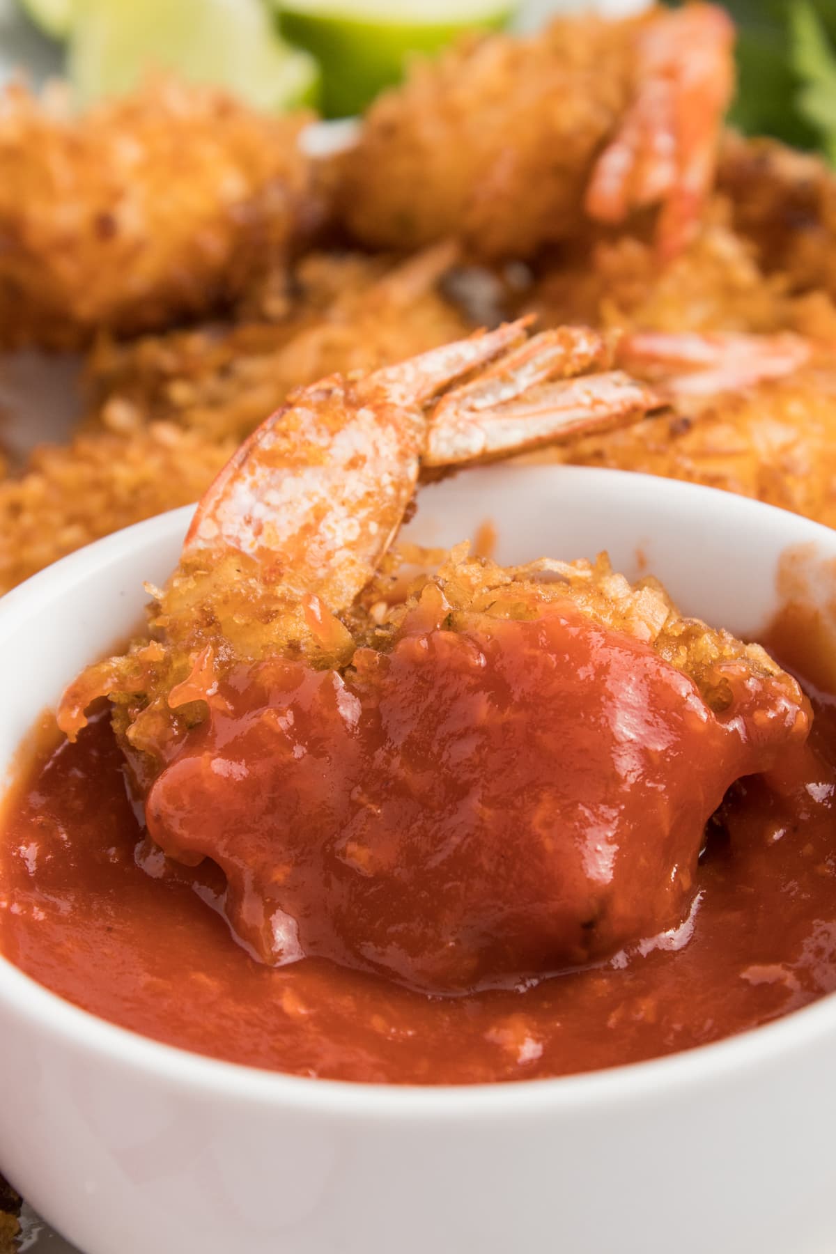 A coconut shrimp in sweet chili sauce