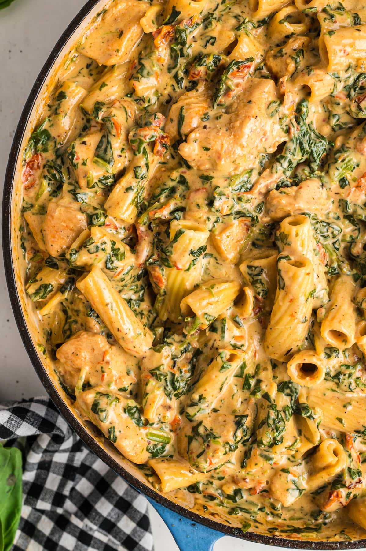 A pan of creamy Tuscan chicken pasta