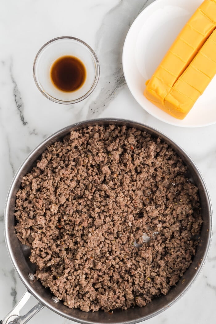 ground beef and sausage cooked in pan