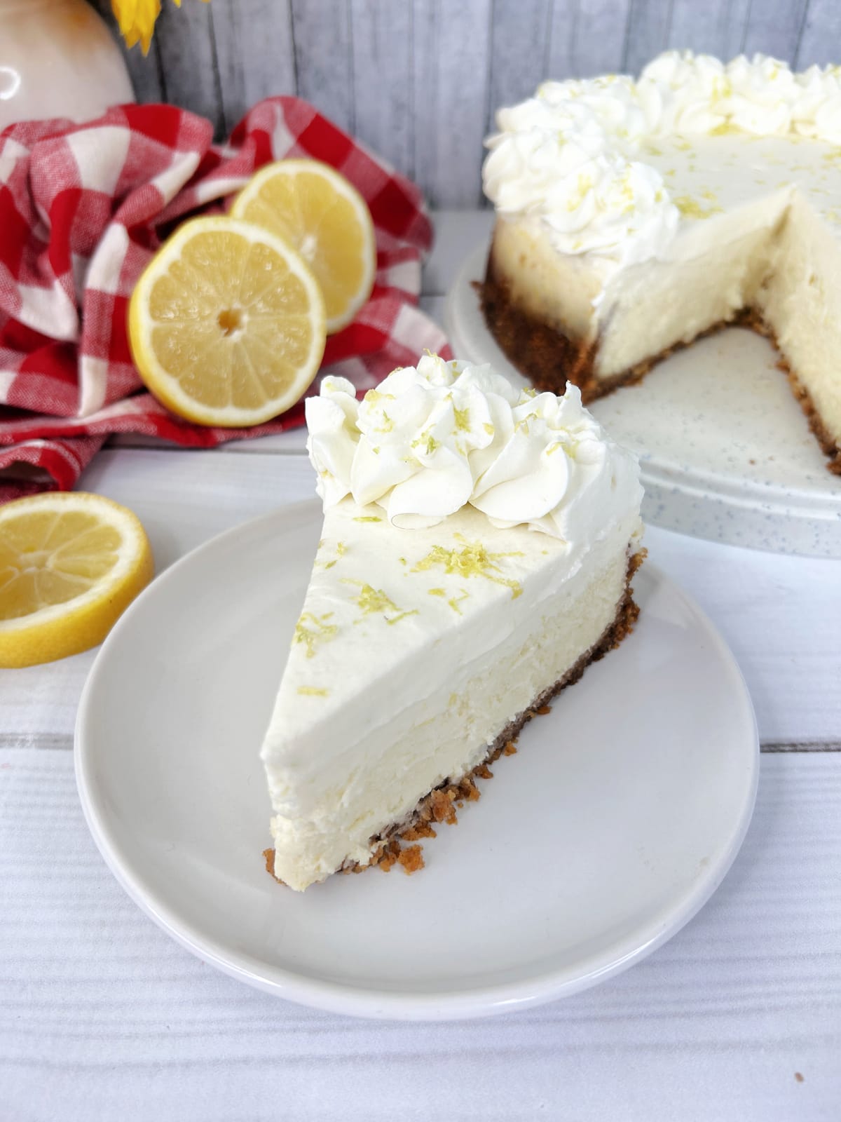 slice of lemon cheesecake with lemon zest on top