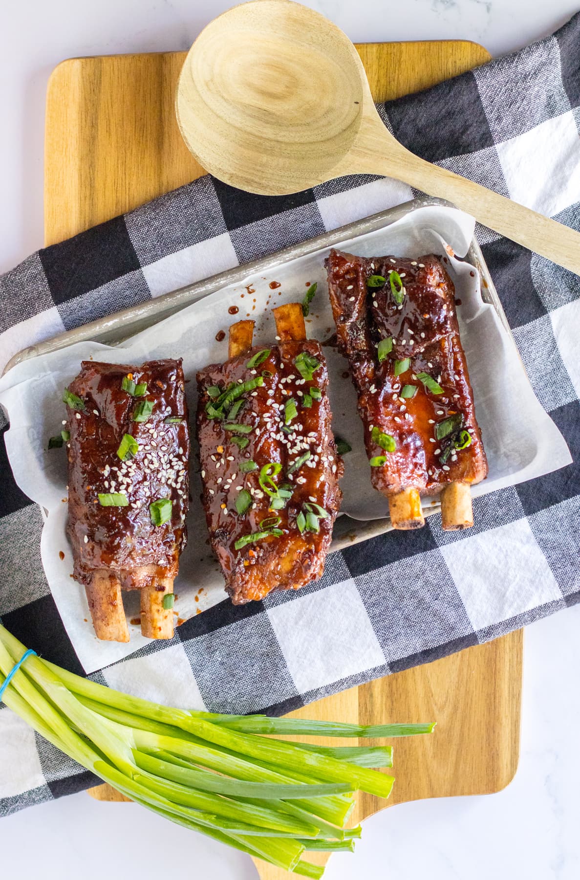 chinese spare ribs with sesame seeds and green onions ready to serve