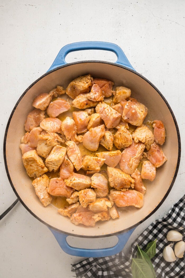 Pieces of chicken breast in a skillet