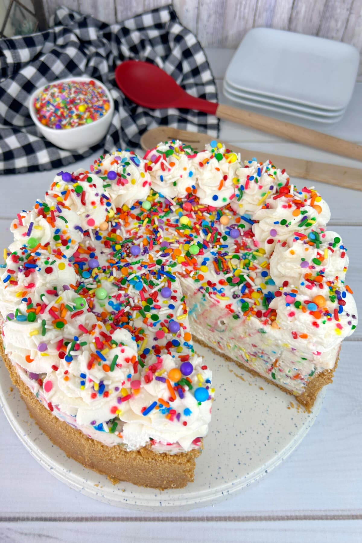funfetti cheesecake on a white plate
