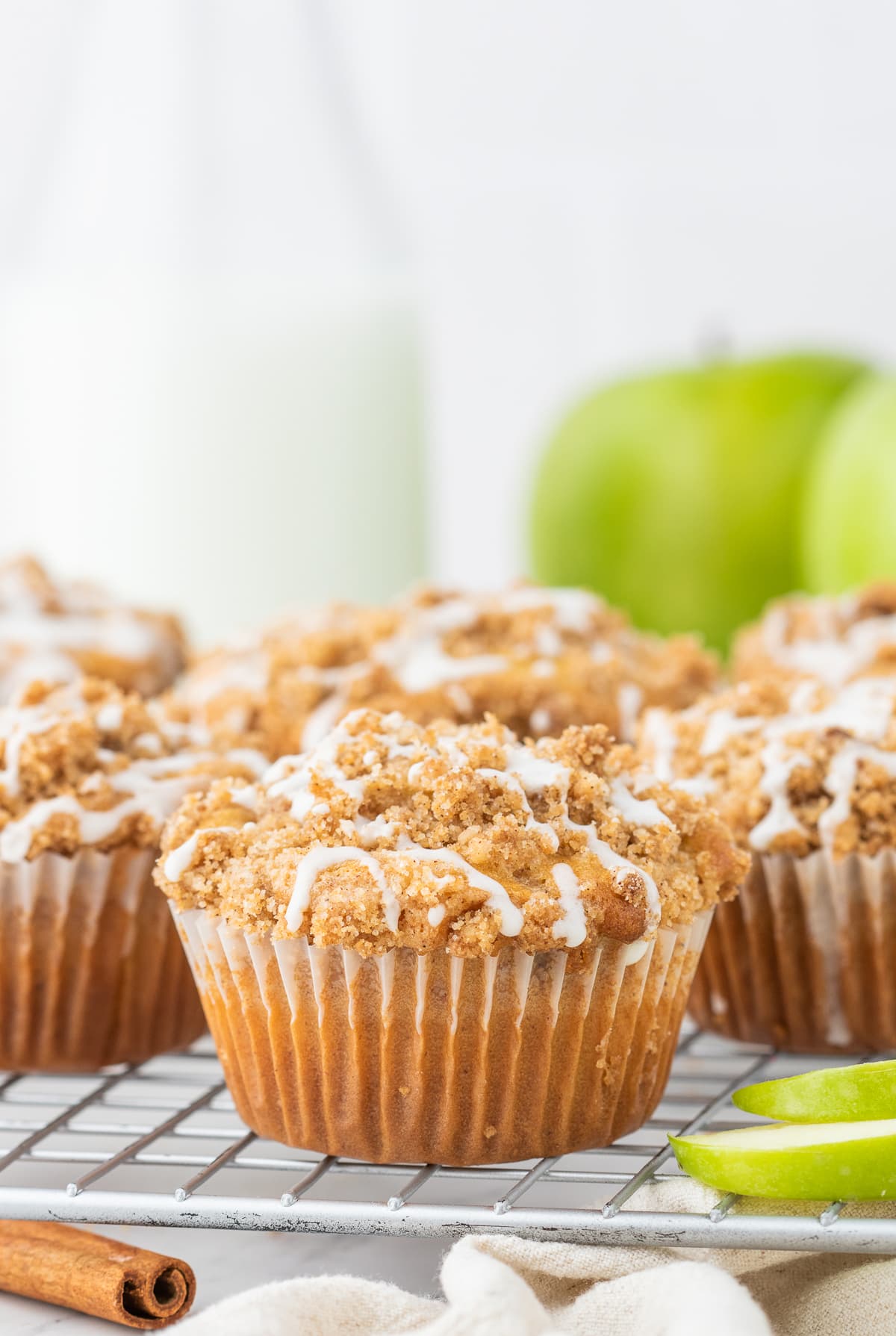 Cinnamon apple muffins on a cooling rack