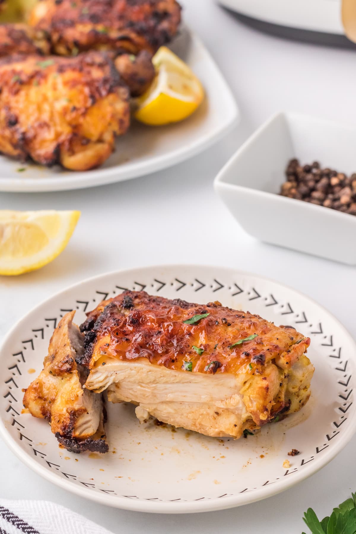 air fryer chicken thighs on white plate