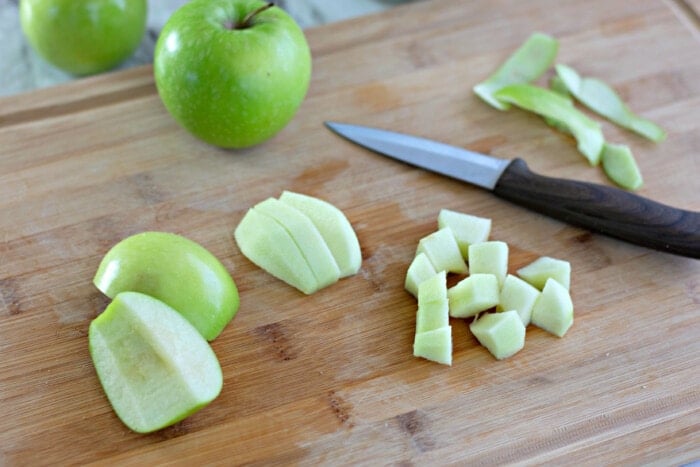 apples being cut for pie