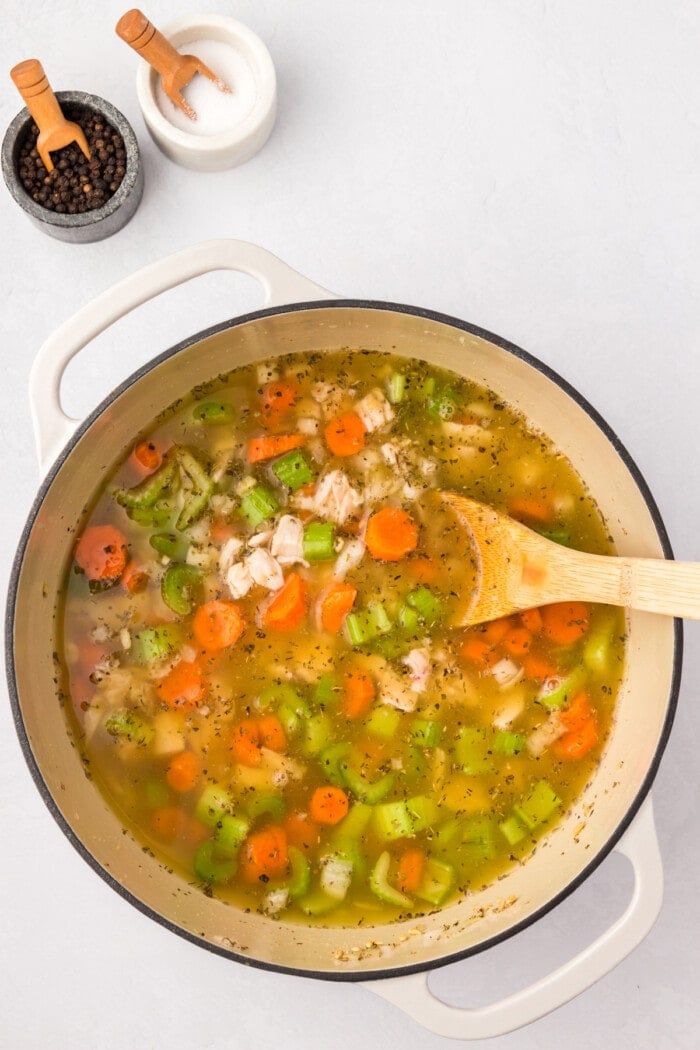 chicken stock in dutch oven with barley and chicken