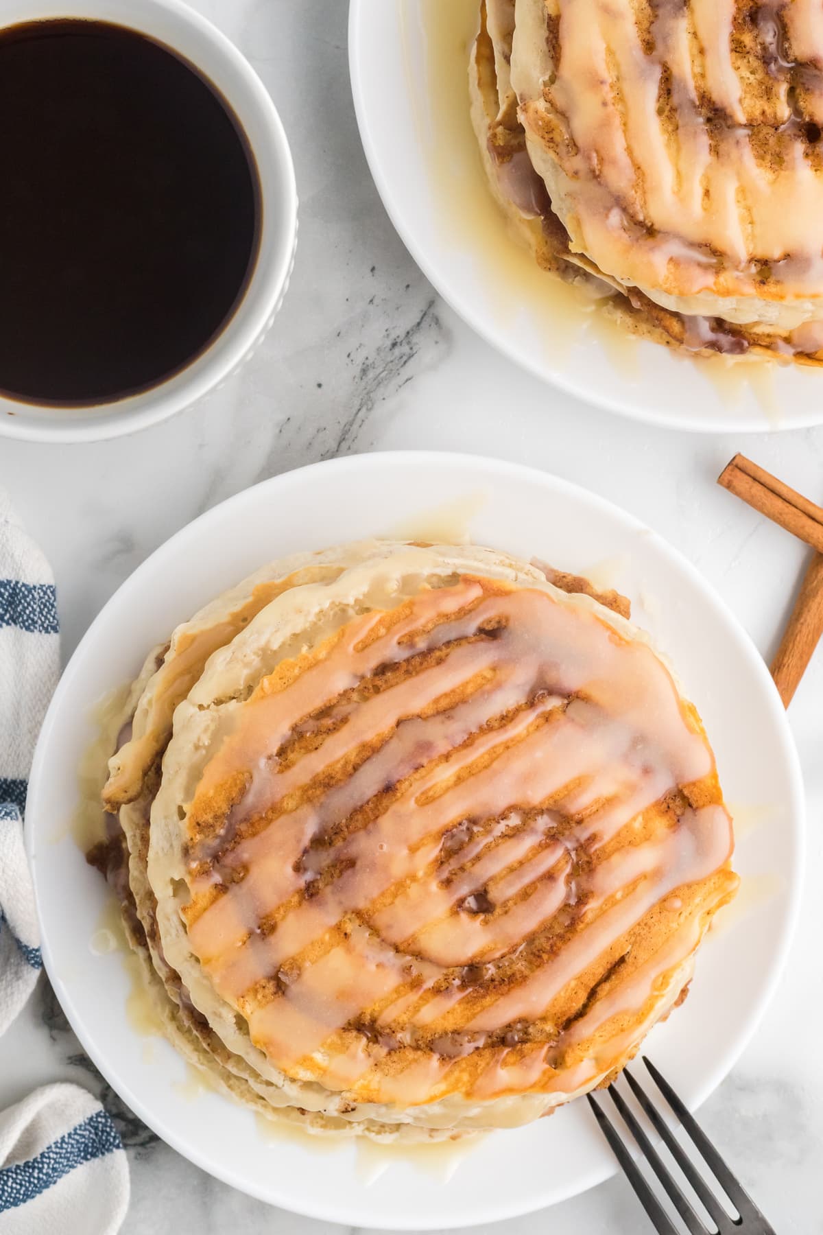 Overhead view of cinnamon roll pancakes on a plate