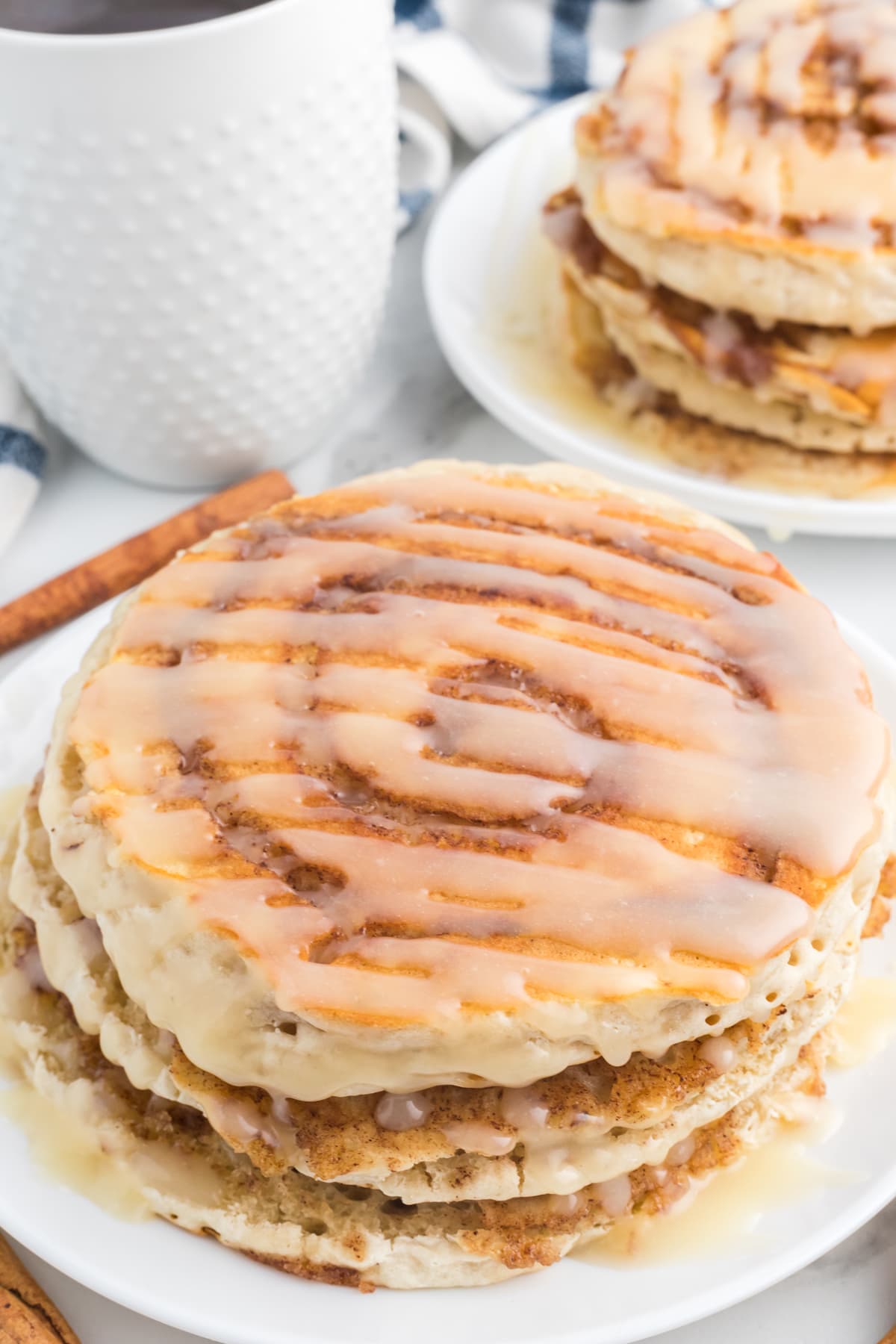 Angled view of a plate of cinnamon roll pancakes
