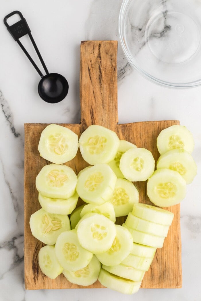slices of cucumber on a cutting board