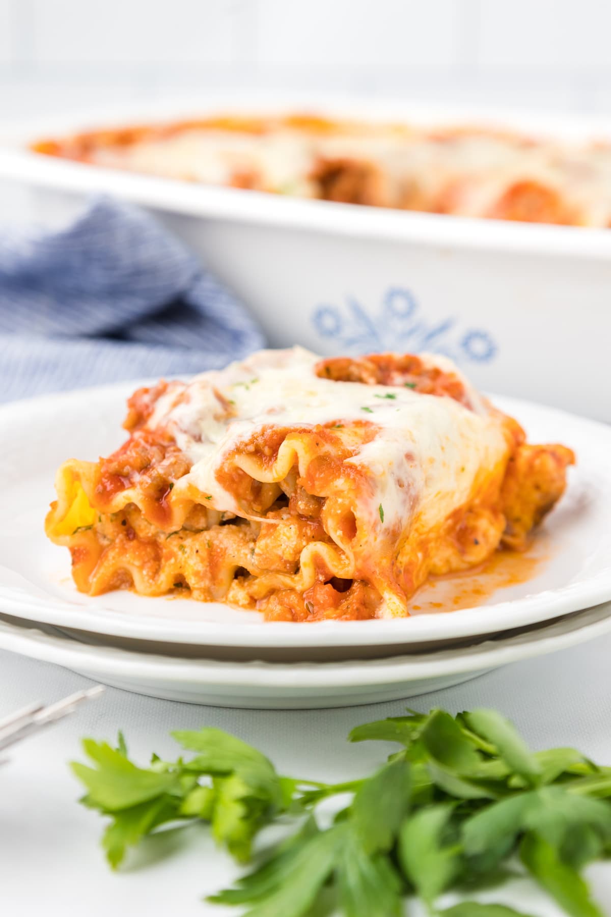 lasagna roll up on white plate