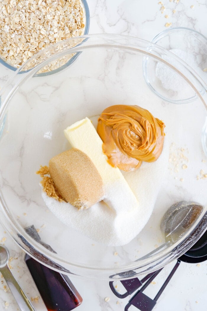 butter, brown sugar, sugar and peanut butter in bowl