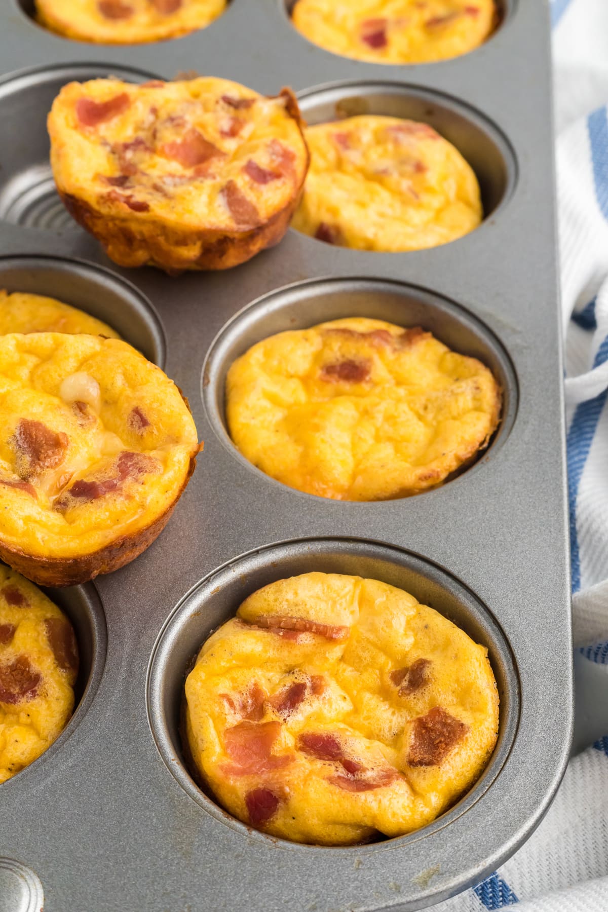 Bacon and gruyere egg bites in a muffin pan