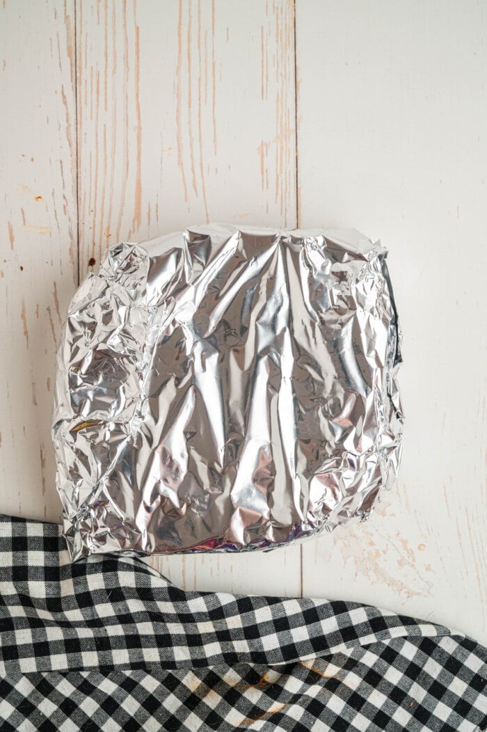 A chuck roast wrapped in foil