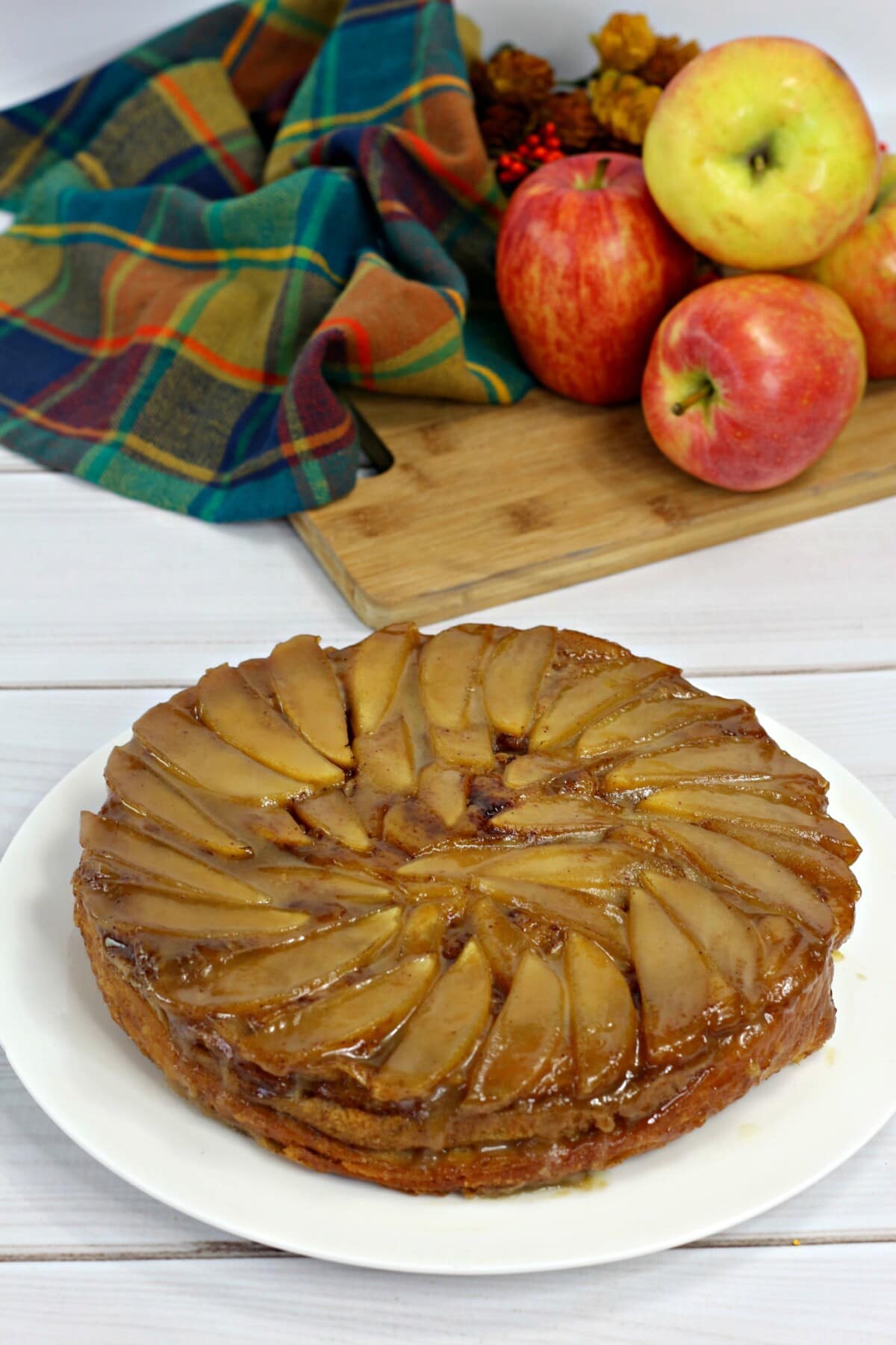 upside down apple cake on a white plate