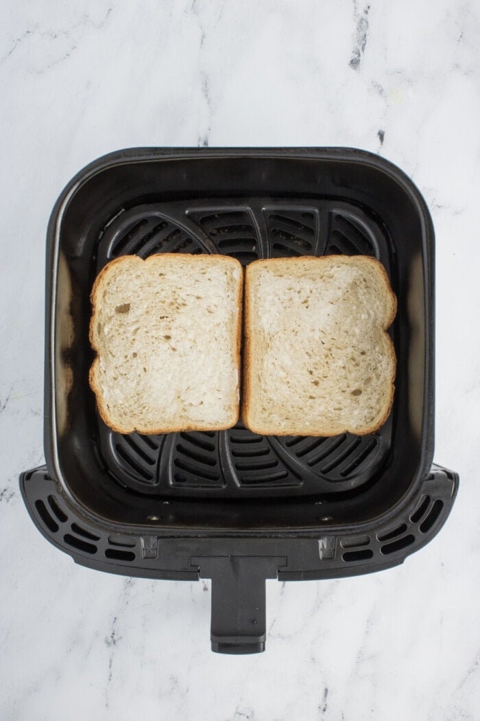 buttered bread in air fryer basket