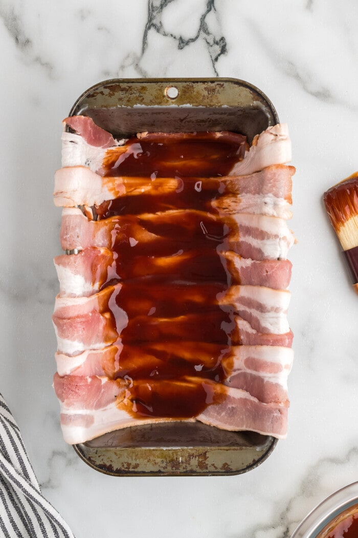 bacon in loaf pan with barbecue glaze on top