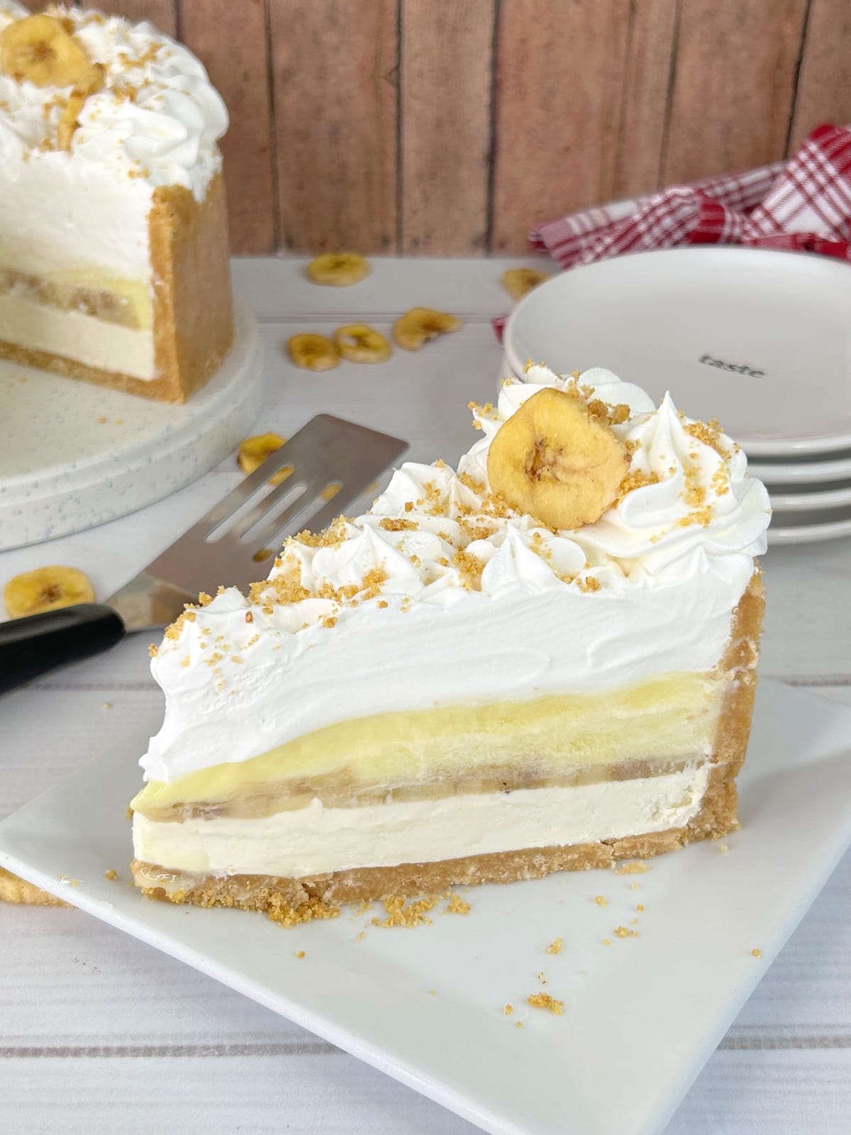 slice of banana pudding cheesecake on white plate