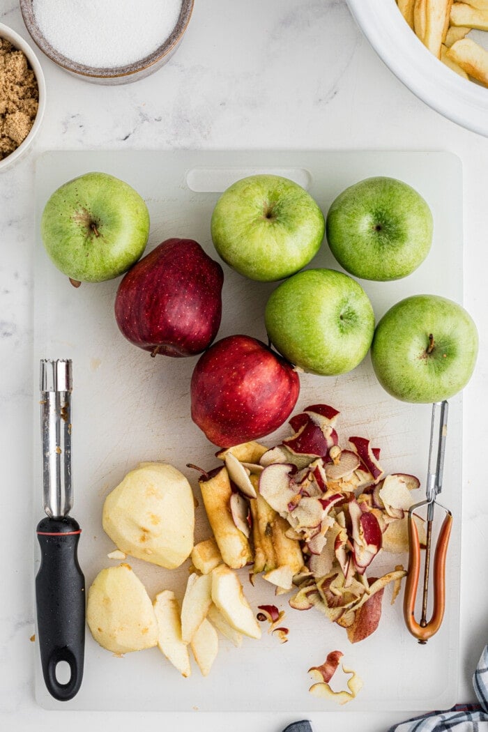 apples peeled on cutting board
