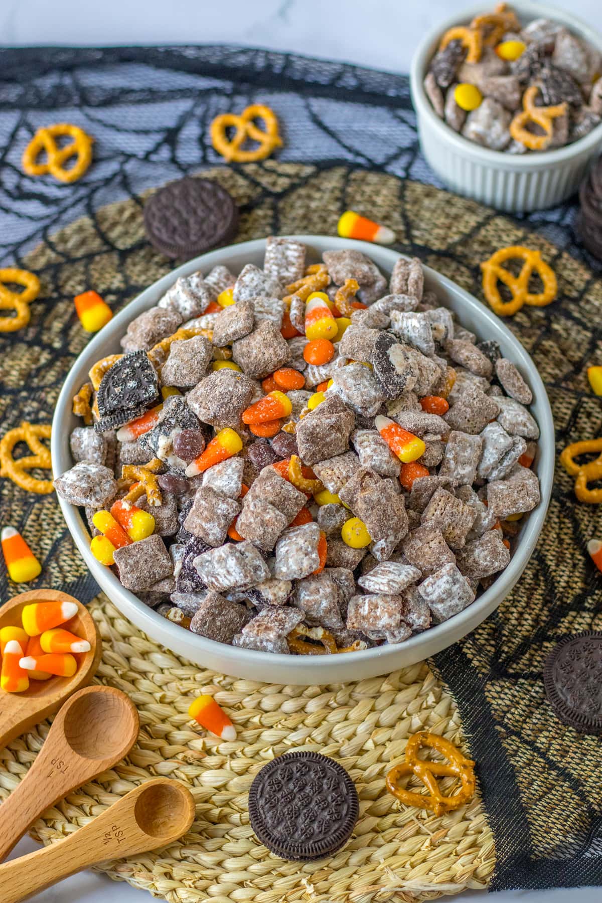 halloween puppy chow in white bowl with candy corn