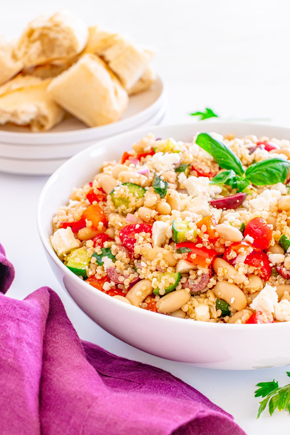 white bowl with Mediterranean quinoa salad