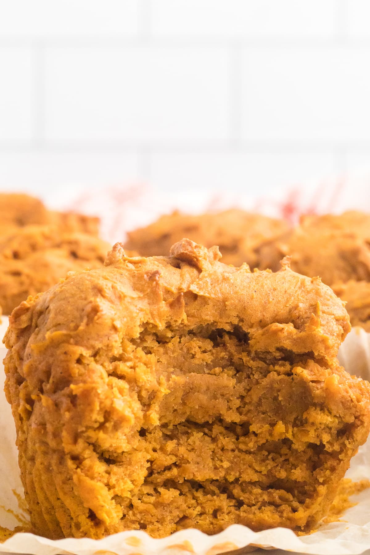 2 Ingredient Pumpkin Muffin with a bite out of the side.