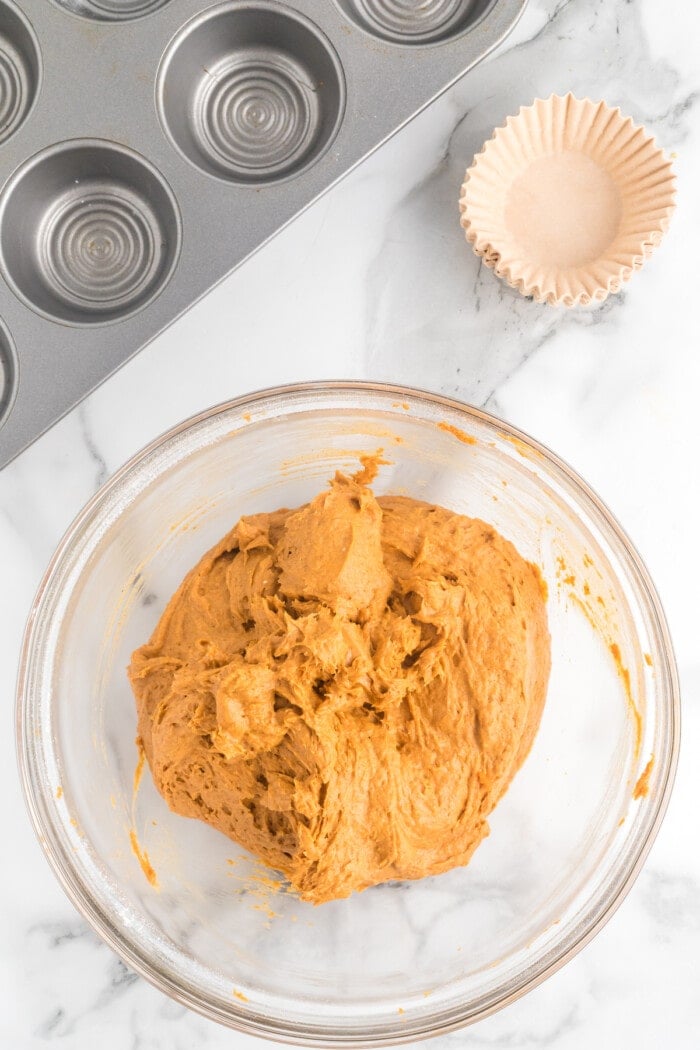 2 Ingredient Pumpkin Muffins batter mixed in a clear bowl.