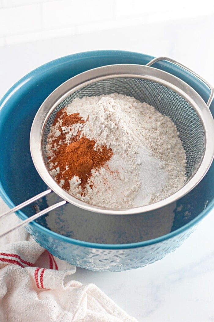 sifting dry ingredients in a bowl