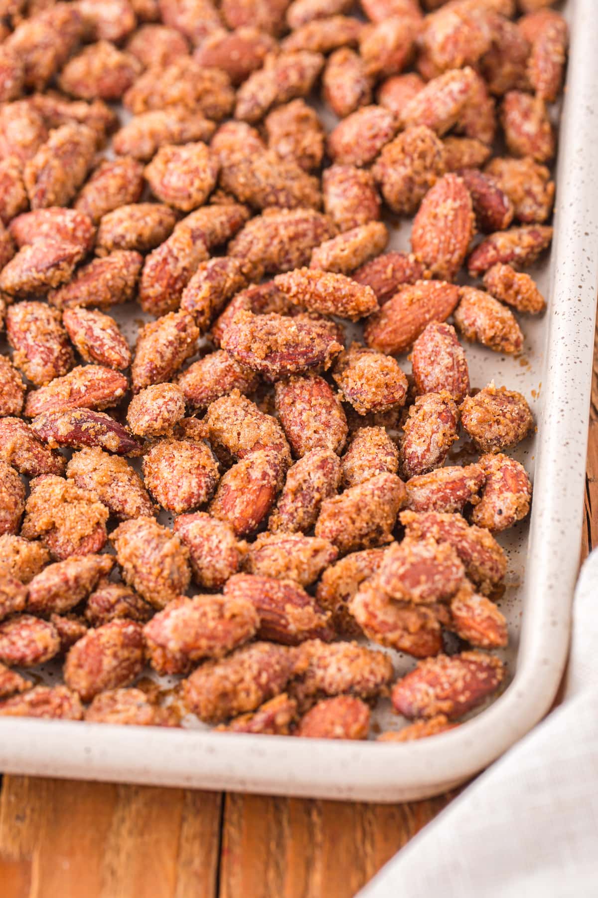 Roasted almonds on a baking sheet.