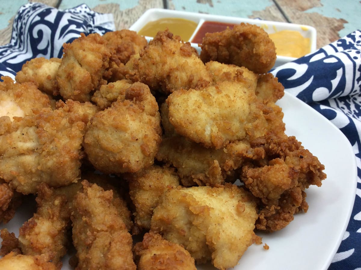 white plate with chick fil a nuggets piled