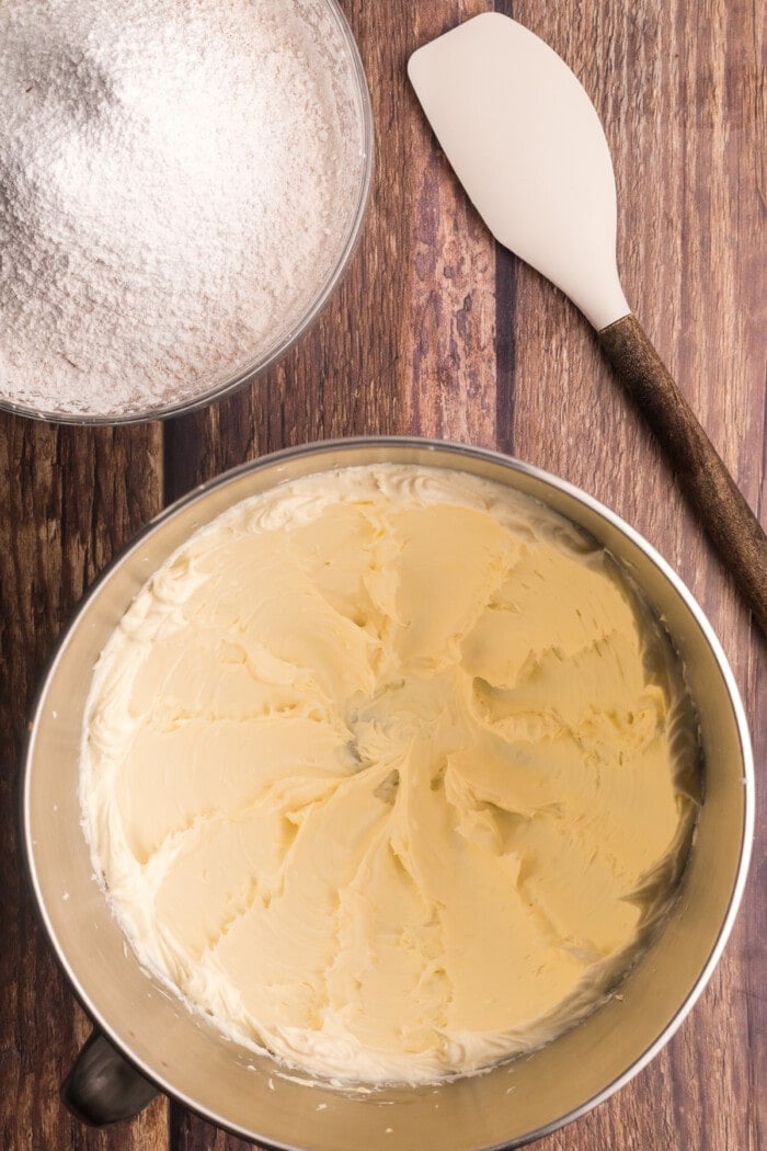 Cream cheese mixed with butter in a mixing bowl