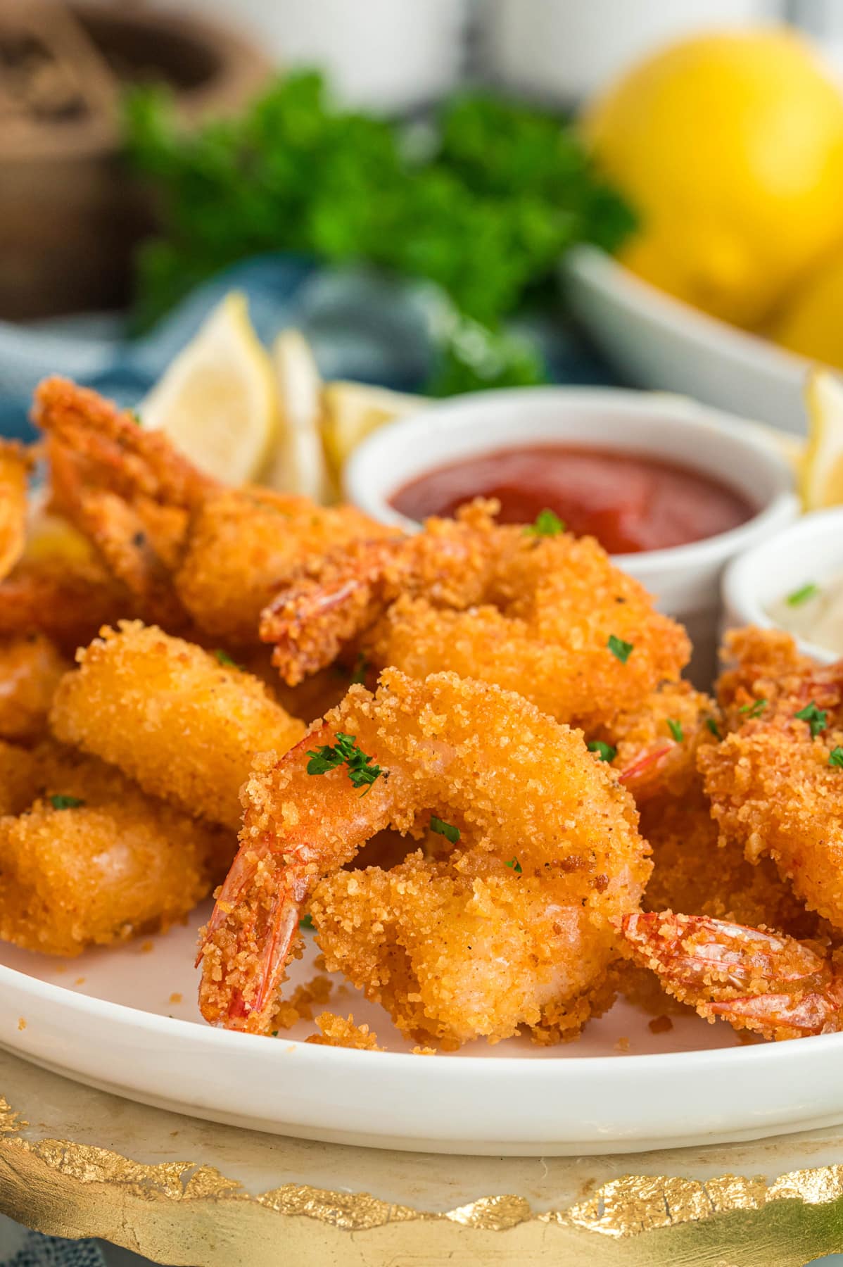 Crispy fried shrimp on a white plate
