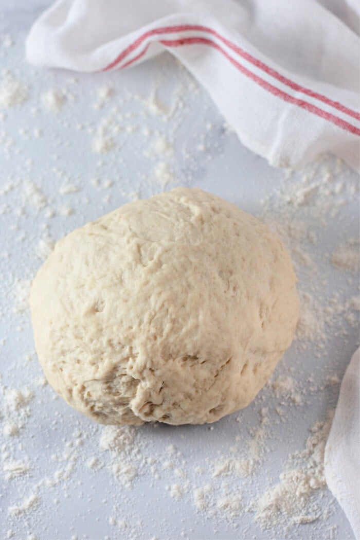 homemade pizza dough rolled into ball