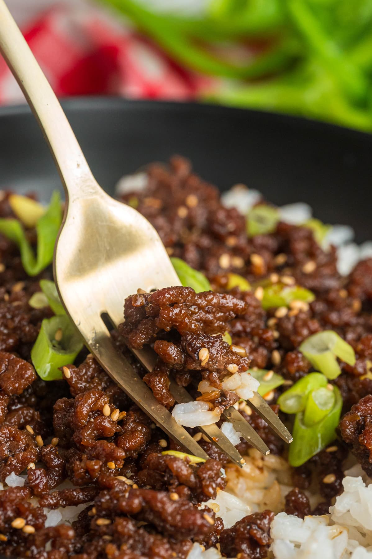 A fork in a bite of Korean ground beef