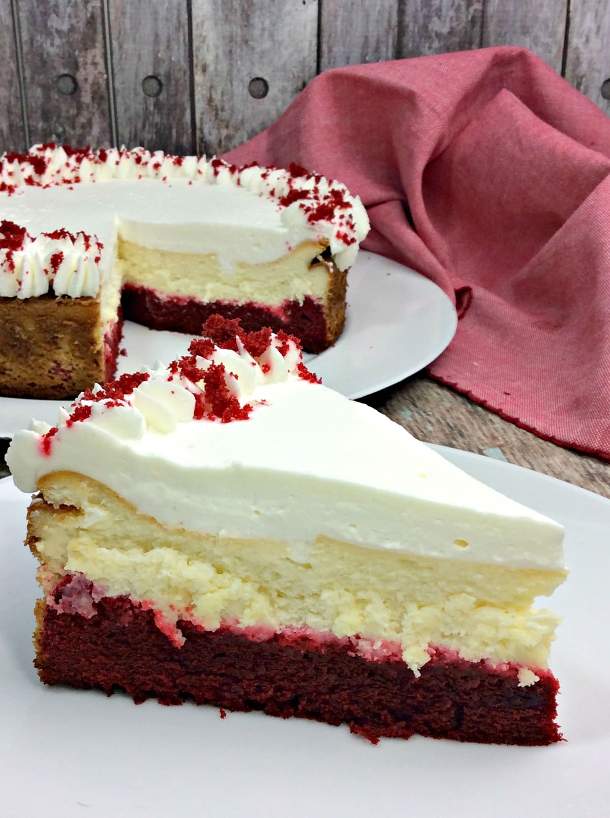sliced red velvet cheesecake on white plate